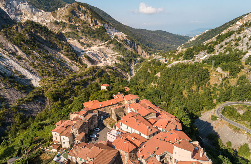 High angle view of townscape by mountains