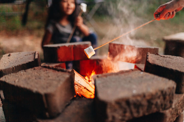 Making smores at home outdoors at the fire pit 