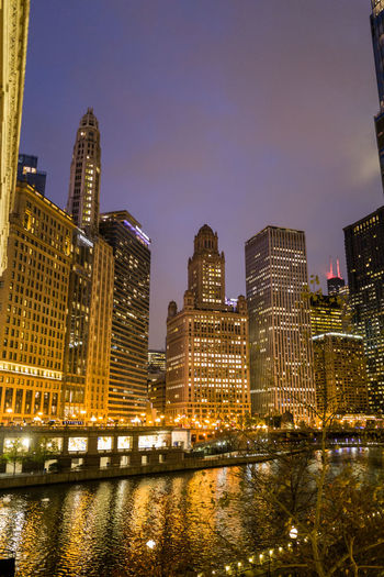 Illuminated buildings in city at night