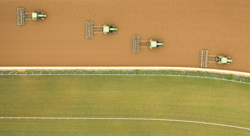 Directly above shot of tractors on field