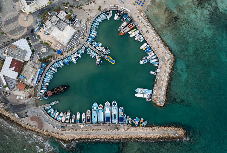 Aerial view of boats and yachts moored in a marina. drone view from above. ayia napa cyprus