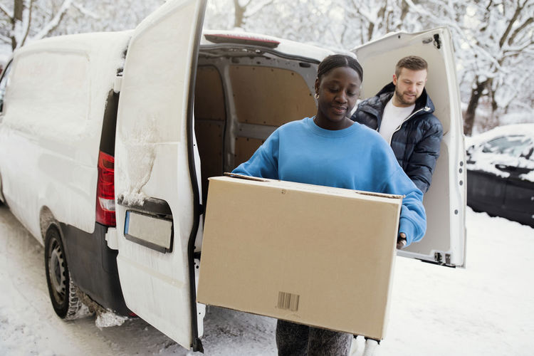 Couple unloading van