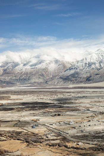 Scenic view of snowcapped mountains against sky