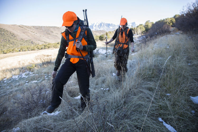 Two female hunters hike in the morning to hunt elk in colorado