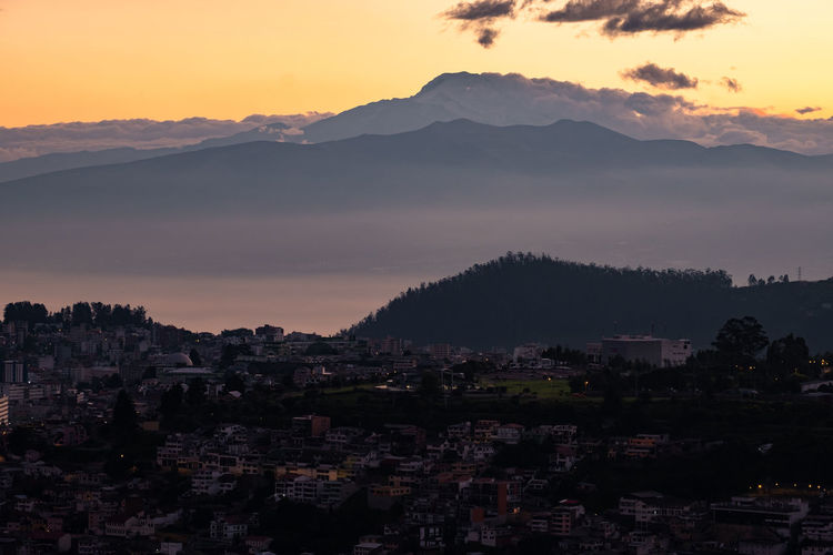 Panoramic view of cayambe volcano behind the city of quito, ecuador.