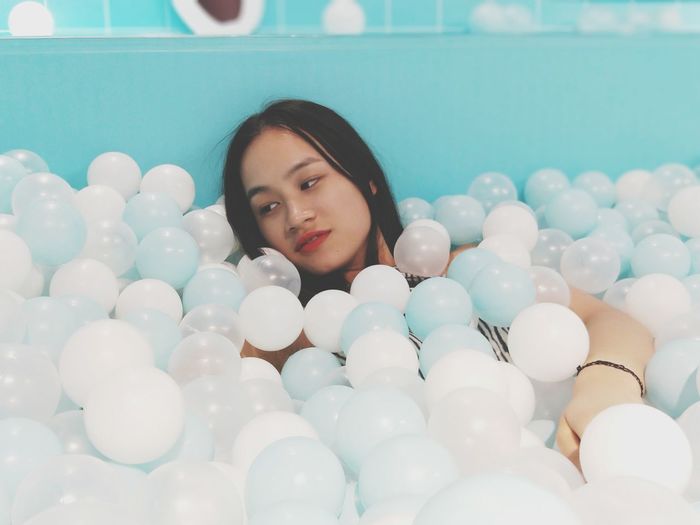 Young woman in ball pool