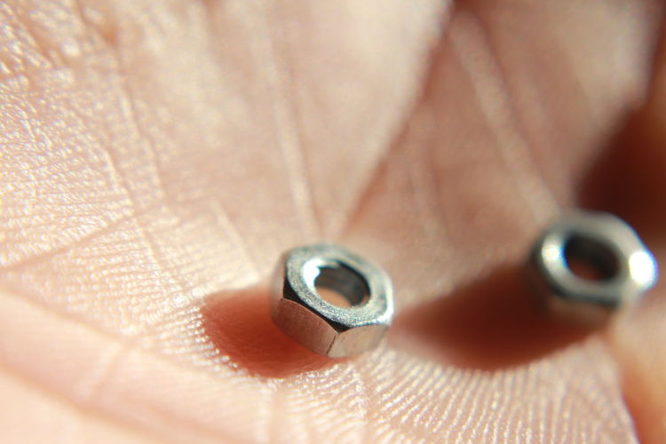 Close-up of bolts in hand