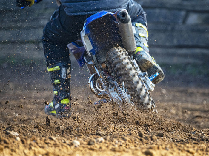 Man riding motorcycle in mud