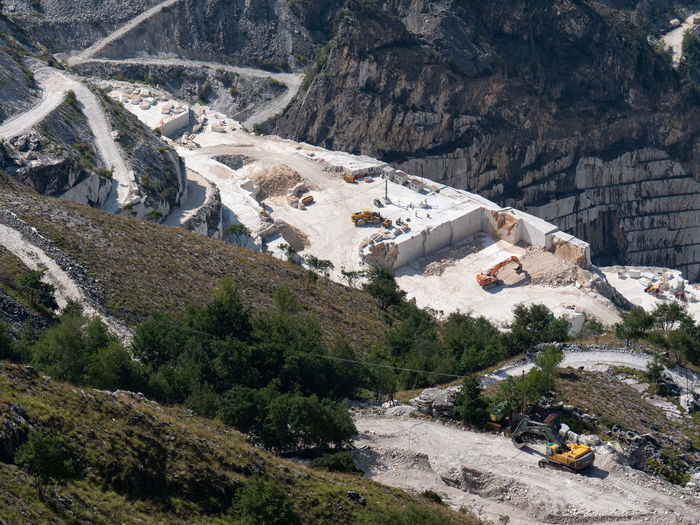 View of the carrara marble quarries with excavation vehicles ready for work.