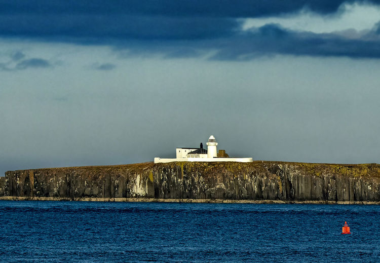 The lighthouse on the farne islands off the northumberland coast, england