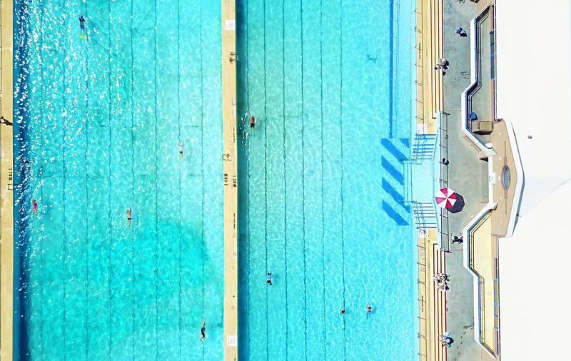 Aerial view of swimming pool during sunny day
