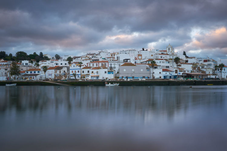 Ferragudo city beach landscape at sunrise in algarve, portugal