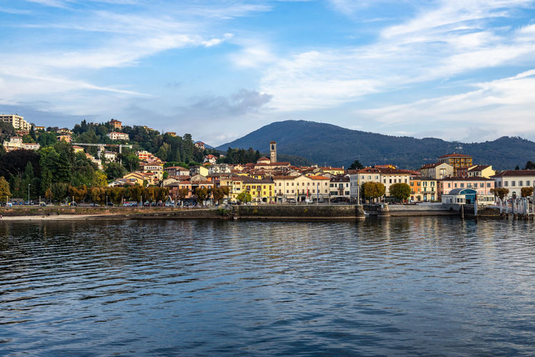 View of luino from a ferry boat cruising on lake maggiore, lombardy, italy