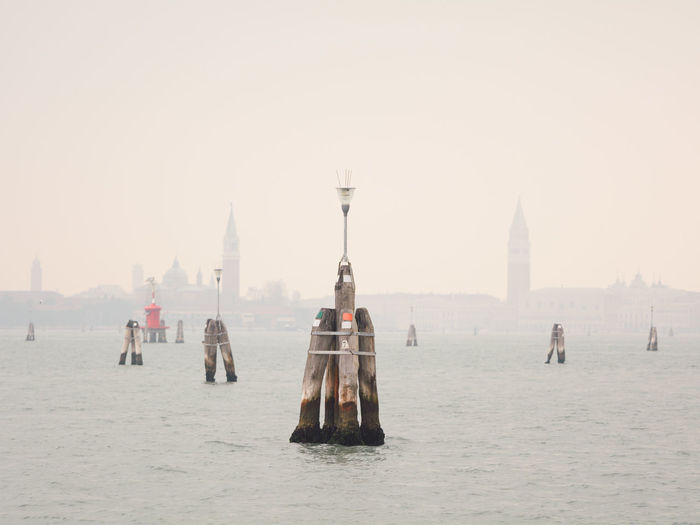 Measurement in sea against sky