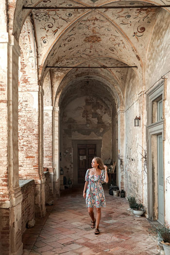 Woman standing in historic building