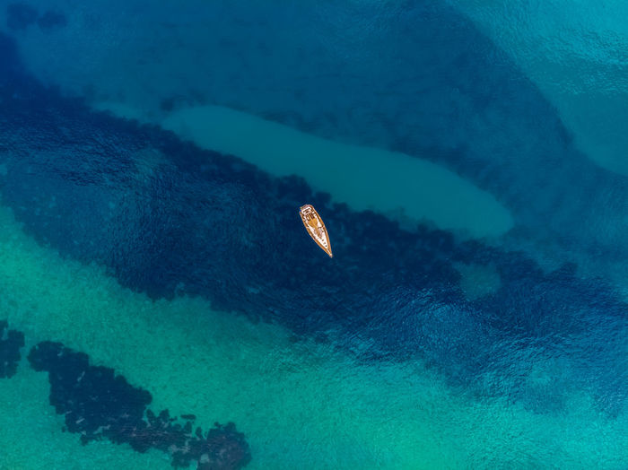 Aerial view of boat on turquoise sea