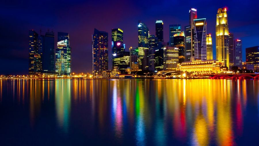 Illuminated city at waterfront