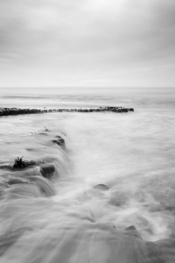 Blurred motion of sea against sky