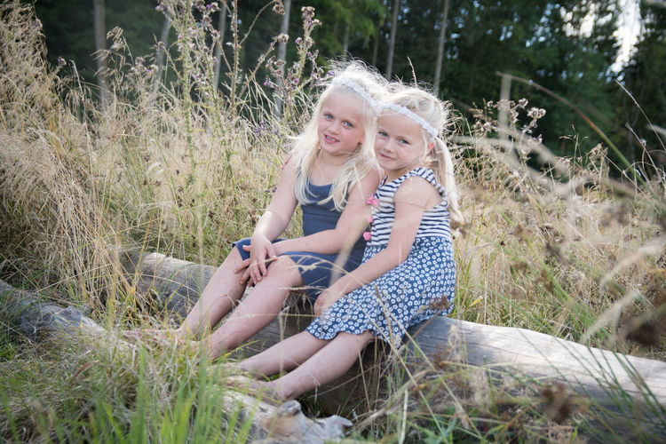Portrait of young girls in field