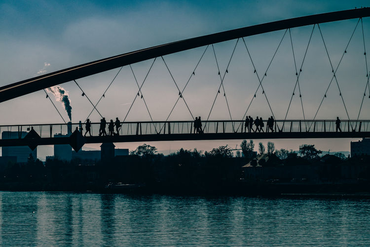 Footbridge over river at dusk