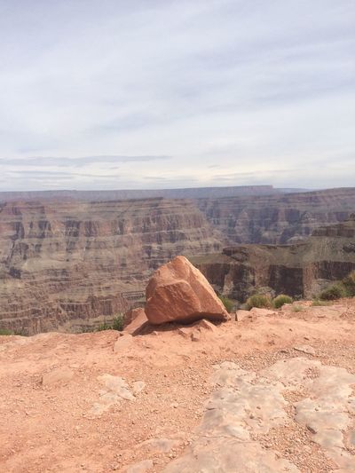 Rocks on desert against sky