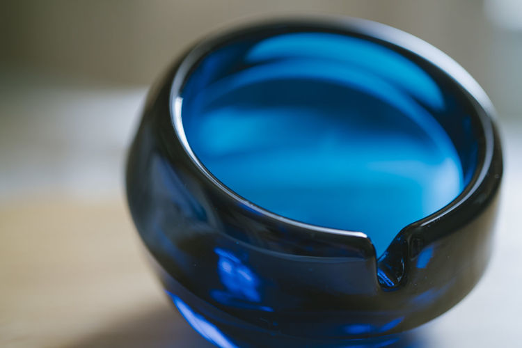 High angle view of blue glass on table