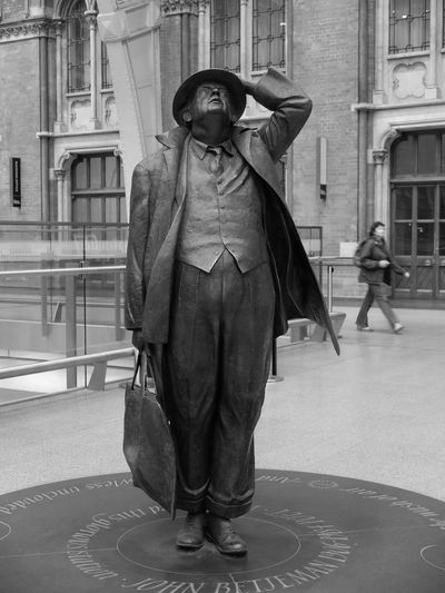 Full length of man standing in front of building
