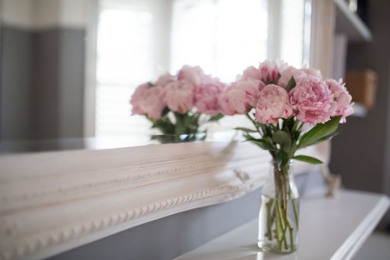 Close-up of pink roses on table at home