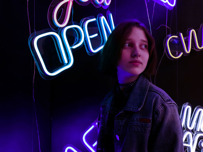 Portrait of woman with light painting at night