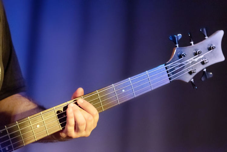 Cropped image of man playing guitar