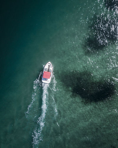 Aerial view of motorboat sailing in sea