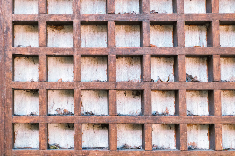 Vintage background with square wooden cells.