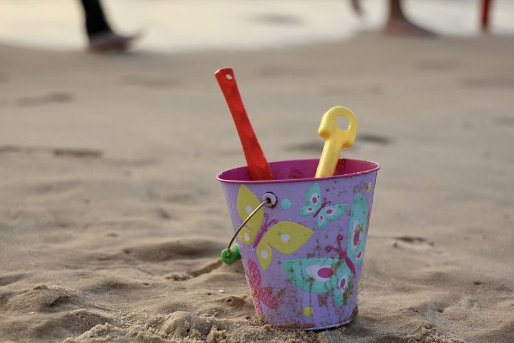 Close-up of toy on beach