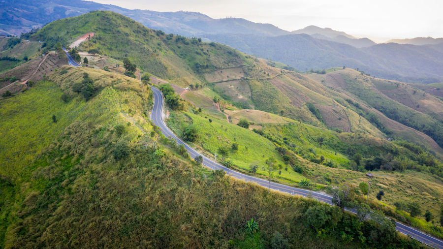 Aerial view mountain paths rural road between the city and valley in at doi chang chiang rai 