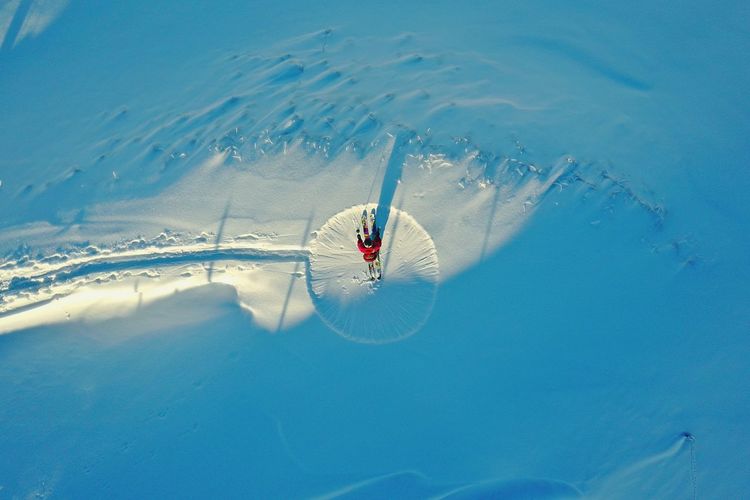 Directly above shot of person skiing on snowy mountain