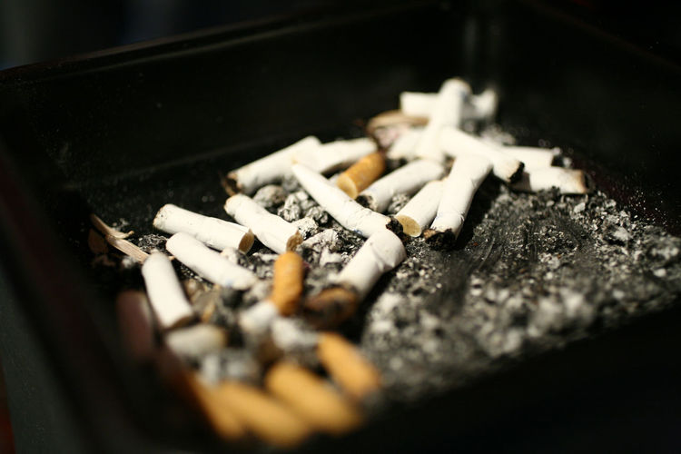 Close-up of cigarettes in ashtray