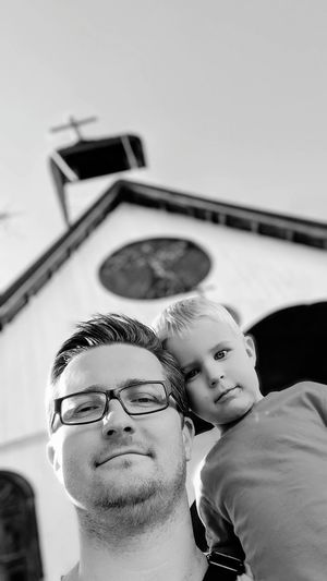 Low angle portrait of father and son