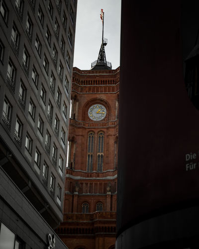 Low angle view of clock tower in city
