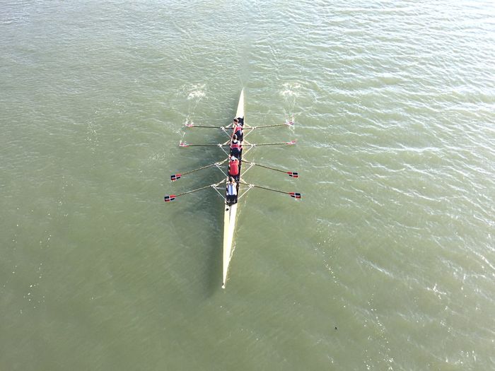 High angle view of people on rowboat in river