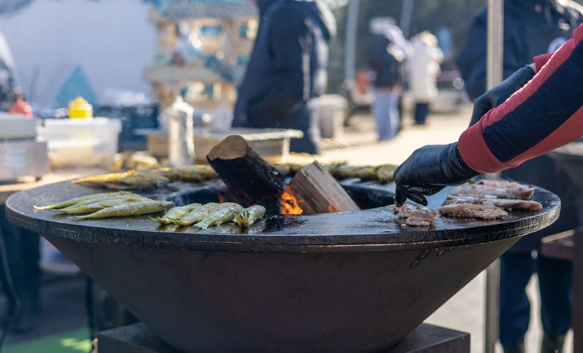 Smelt fish is fried on a large grill during the fish festival in svetlogorsk kalinigrad region