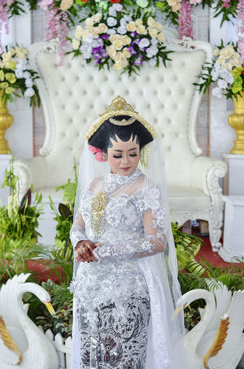 Portrait of young woman with bouquet