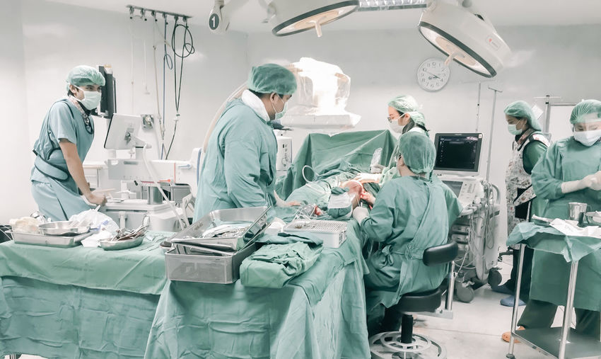 Doctors working in operating room at hospital