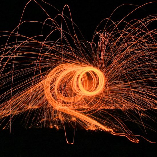 Fire wool burning and light painting at night