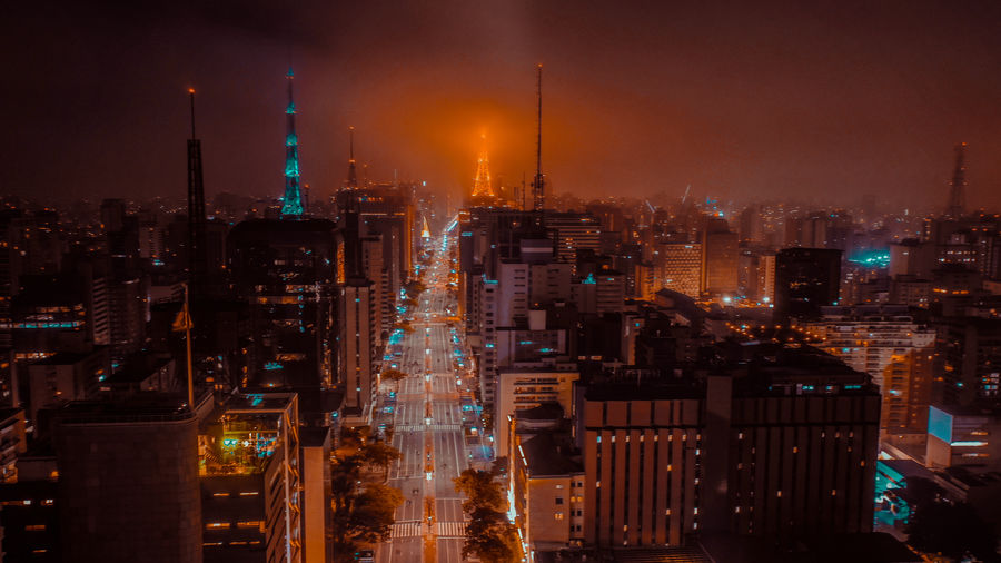 Illuminated buildings in city at night