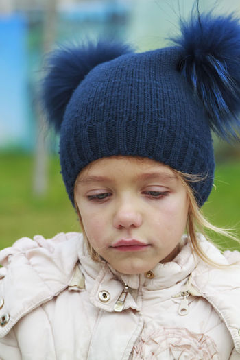 Close-up of sad girl in park