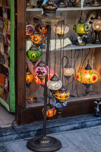 Flower pots hanging on display at store