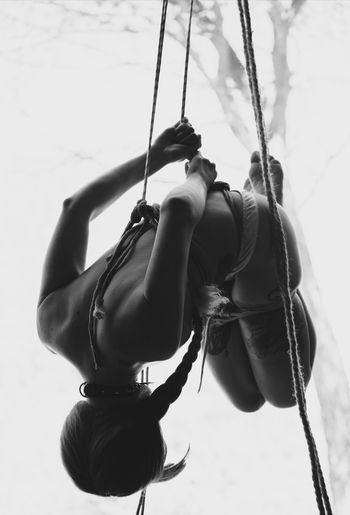 Close-up of swing hanging on rope