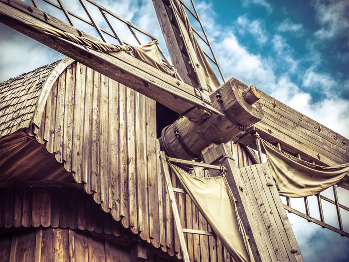 Low angle view of wooden windmill