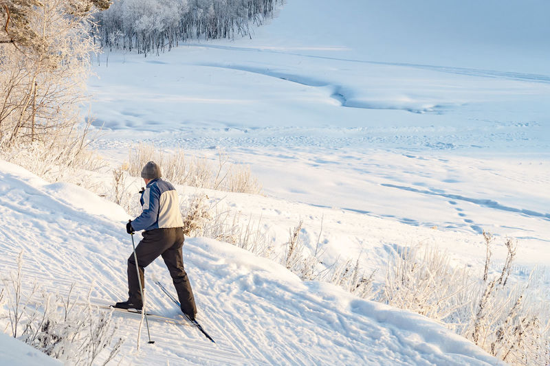 Full length of man on snowcapped field