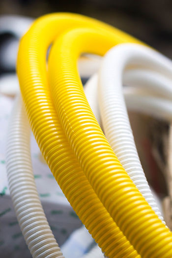 Close-up of white and yellow pipes